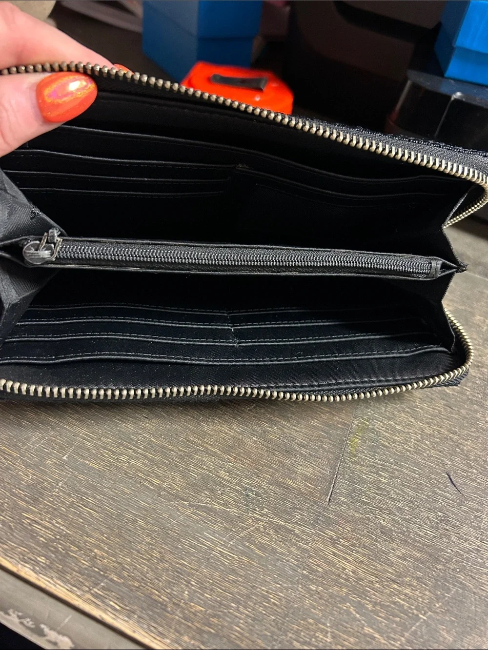 The Sak Black Crochet Zip Wallet with Logo Charm Accordion Style